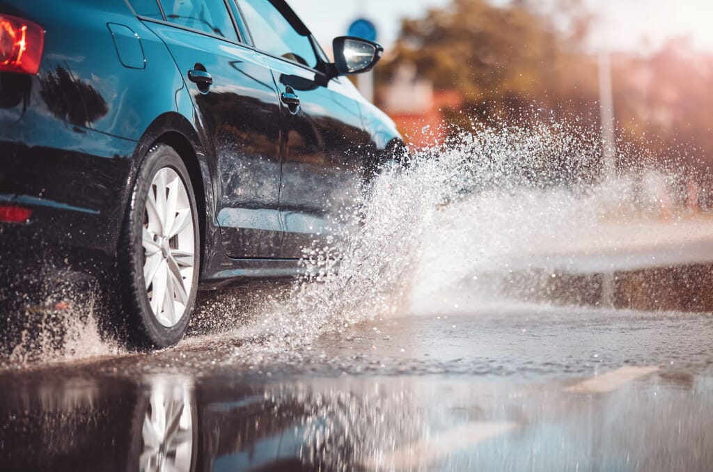 winter tyes driving through a puddle