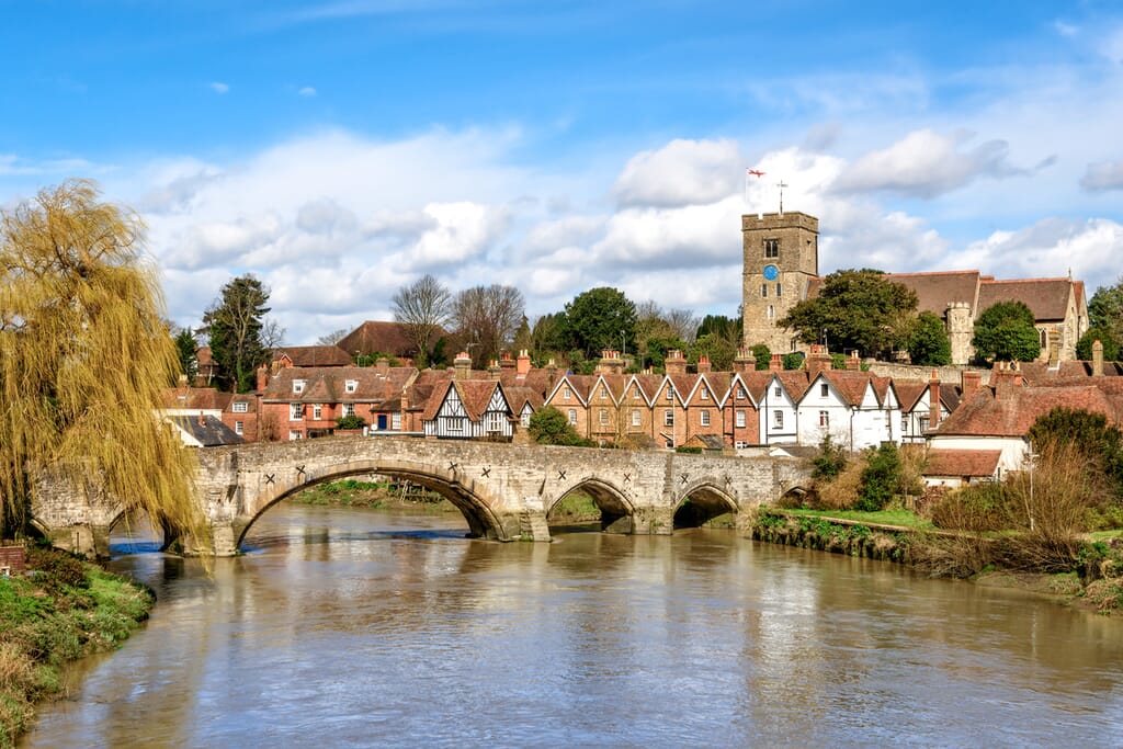 View of Aylesford village in Kent, England with medieval bridge and church.