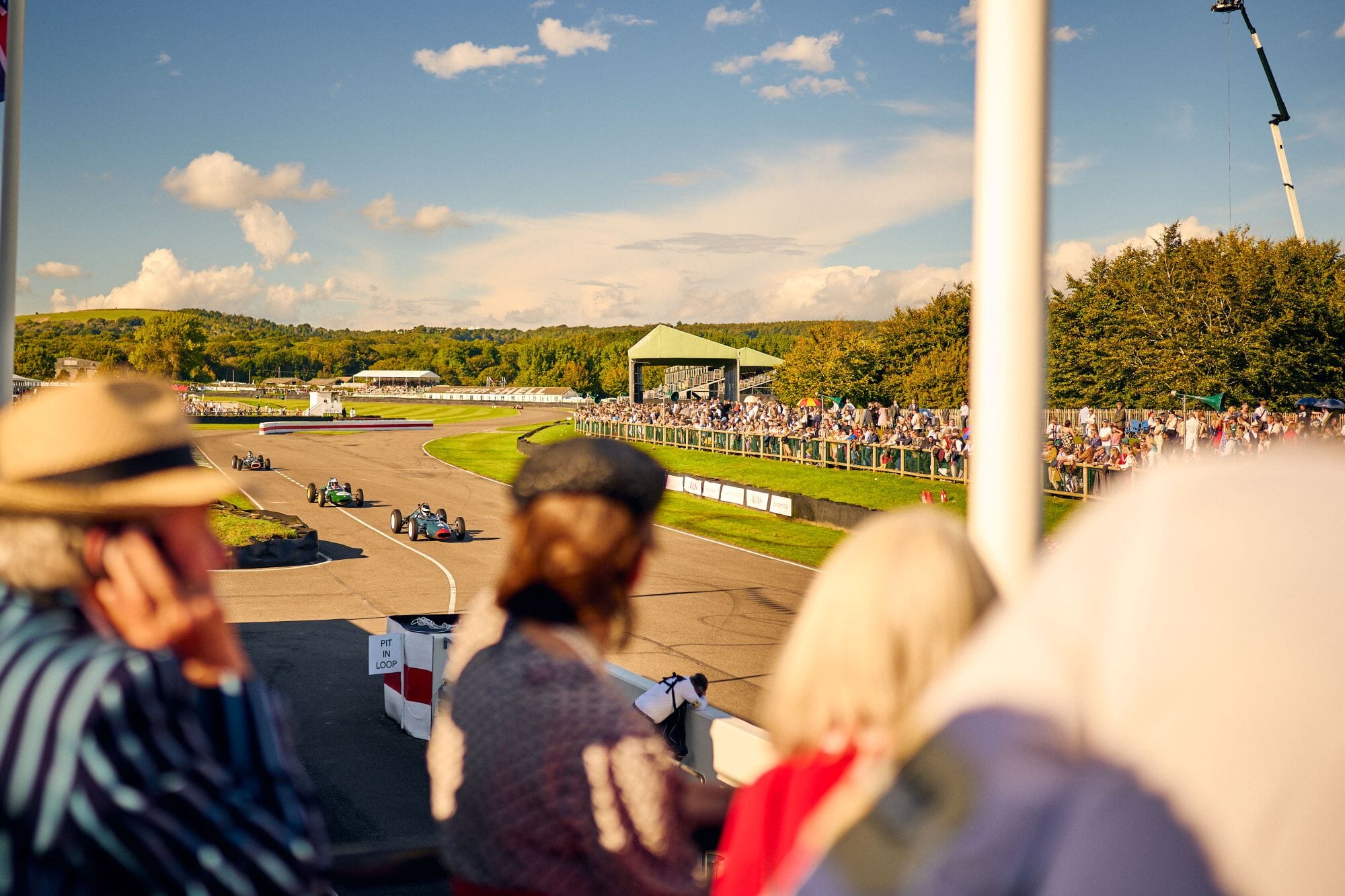 Visitors watching the racing at the 2024 Goodwood Revival. Ph. by Dominic James.